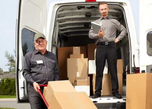 Man with van loading furniture for a local move in Kingston upon Thames
