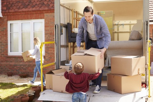 Prepared moving boxes and furniture ready for a Kingston upon Thames removals van