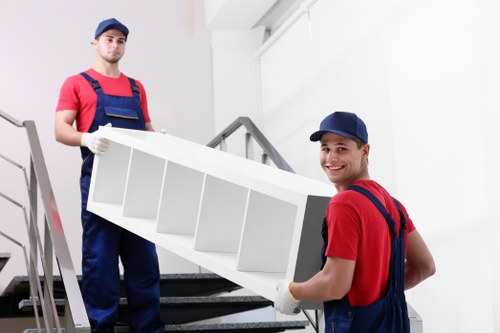 Removal truck loading household items for a Kingstonuponthames relocation