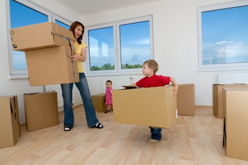 Local moving team organising household items for transport
