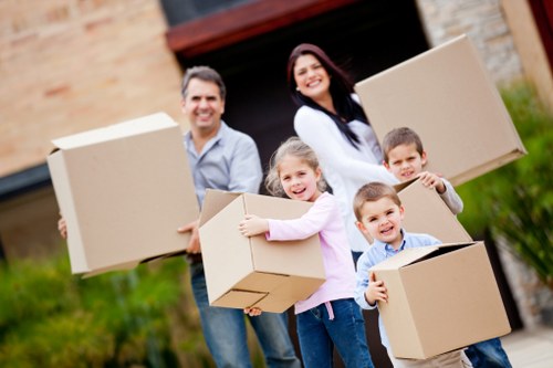 Packed boxes and furniture ready for transport in Kingstonuponthames