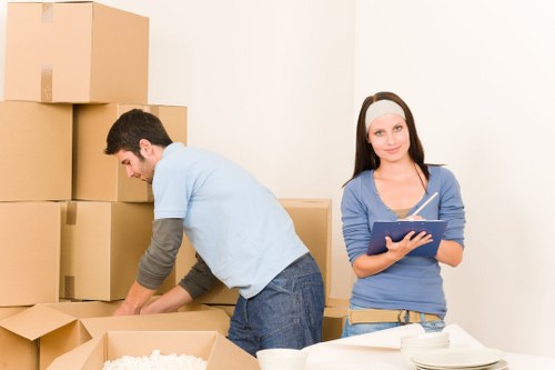 Unloading boxes into a new home during a Kingston upon Thames move