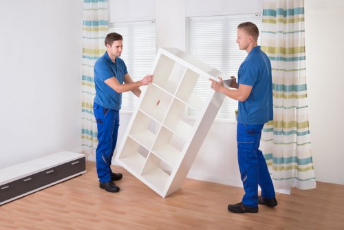 Commercial moving team handling office furniture