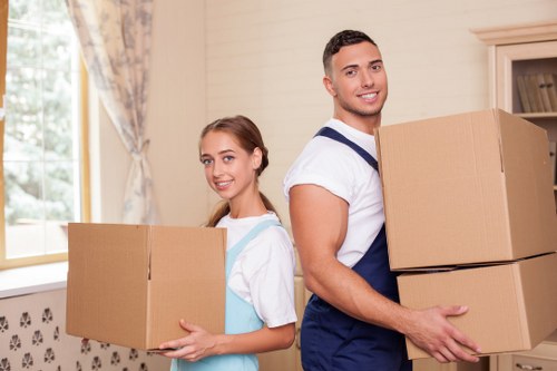 Packed boxes and furniture ready for removals service in Kingstonuponthames