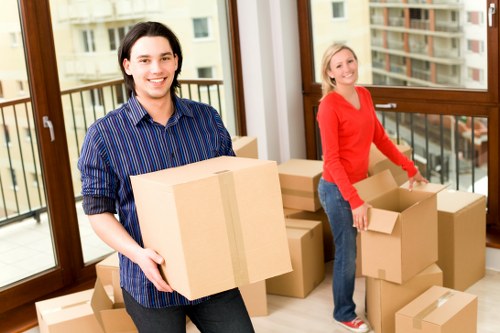 Professional movers handling household furniture during a local Kingstonuponthames move
