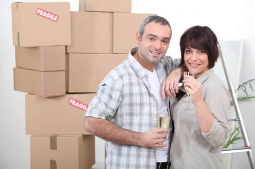 Local movers loading household items into a van