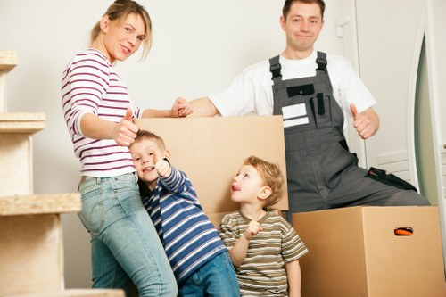 Packed boxes and furniture ready for collection in Kingstonuponthames